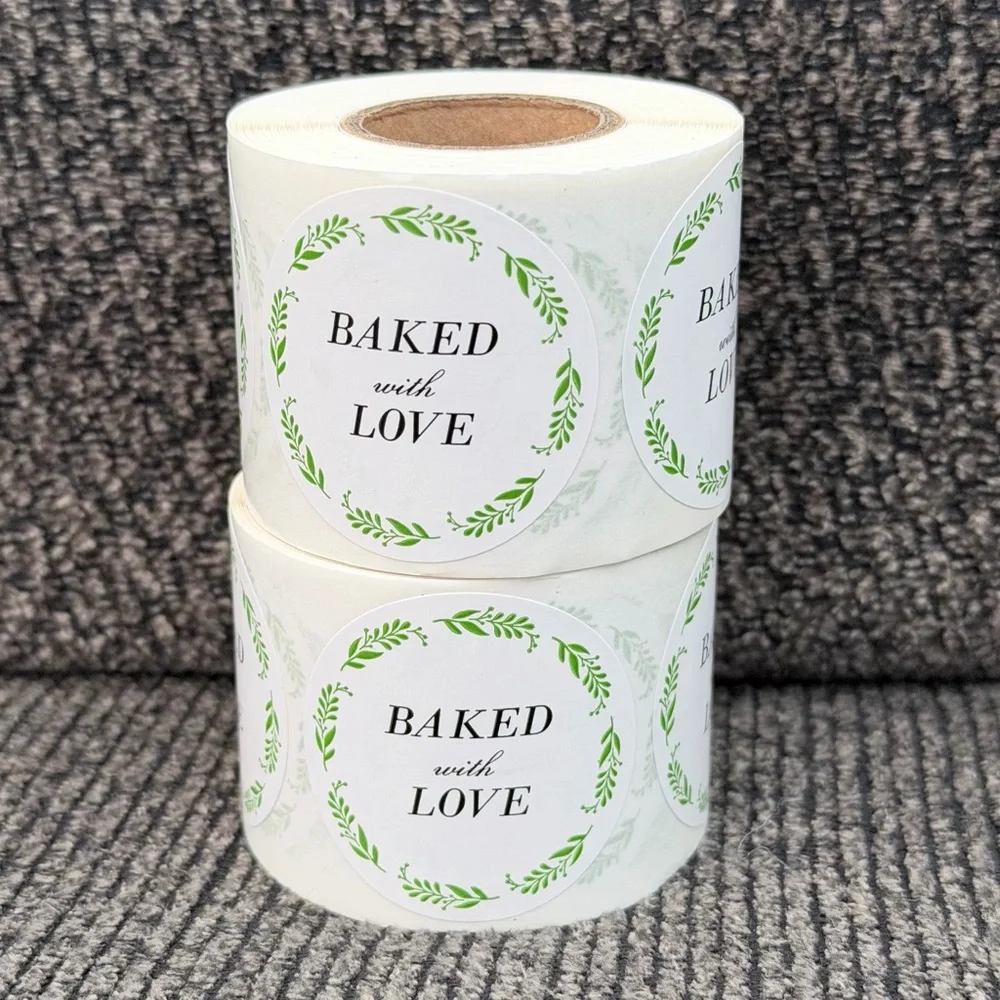 2 rolls of stickers “baked with love” 1.5in